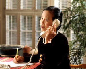 Woman listening to angry attorney on the phone
