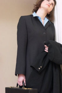 woman in business suit thinking of the myths of legal nurse consulting