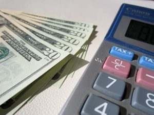 dollars and a calculator - why it is important in keeping track of expenses