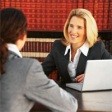 image of attorney and legal nurse consutlant by a computer
