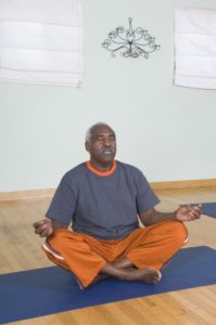 senior man meditating