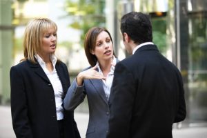 two-business-woman-and-a-man-talking