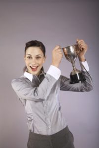 woman holding trophy