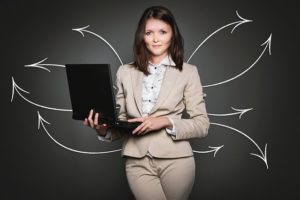woman holding lap top to symbolize a successful LNC business