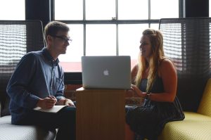 man and woman with laptop