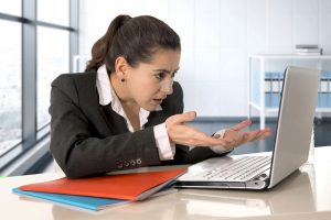 What Is Technology Addiction a female professional at laptop