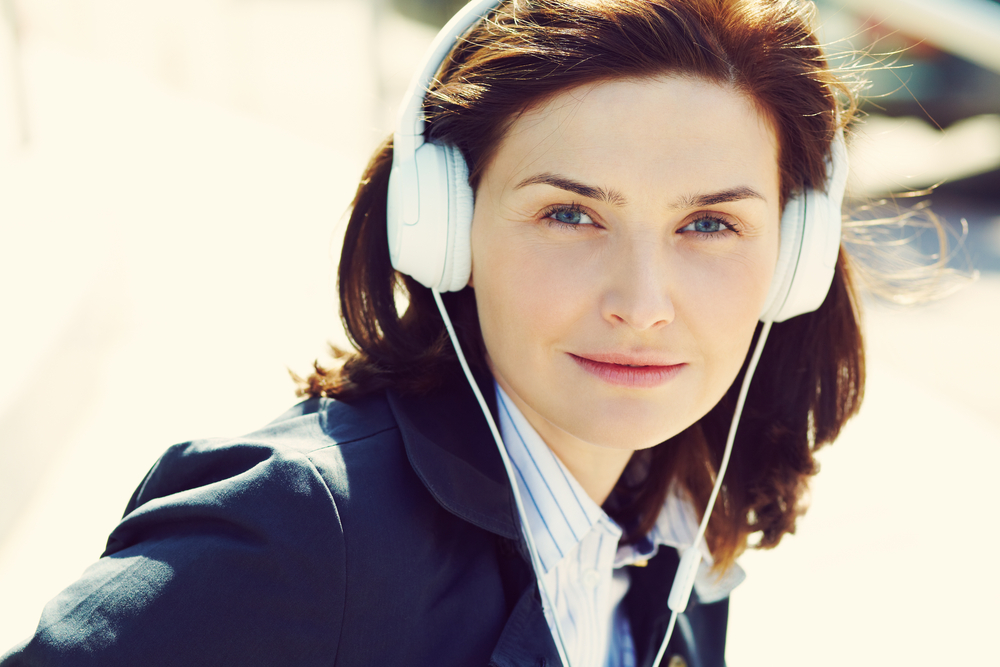 Outdoor,Portrait,Of,A,Stylish,Woman,With,Headphones,In,A Outdoor,Portrait,Of,A,Stylish,Woman,With,Headphones,In,A