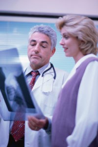 doctor and nurse looking at x-ray to determine hospital quality of care